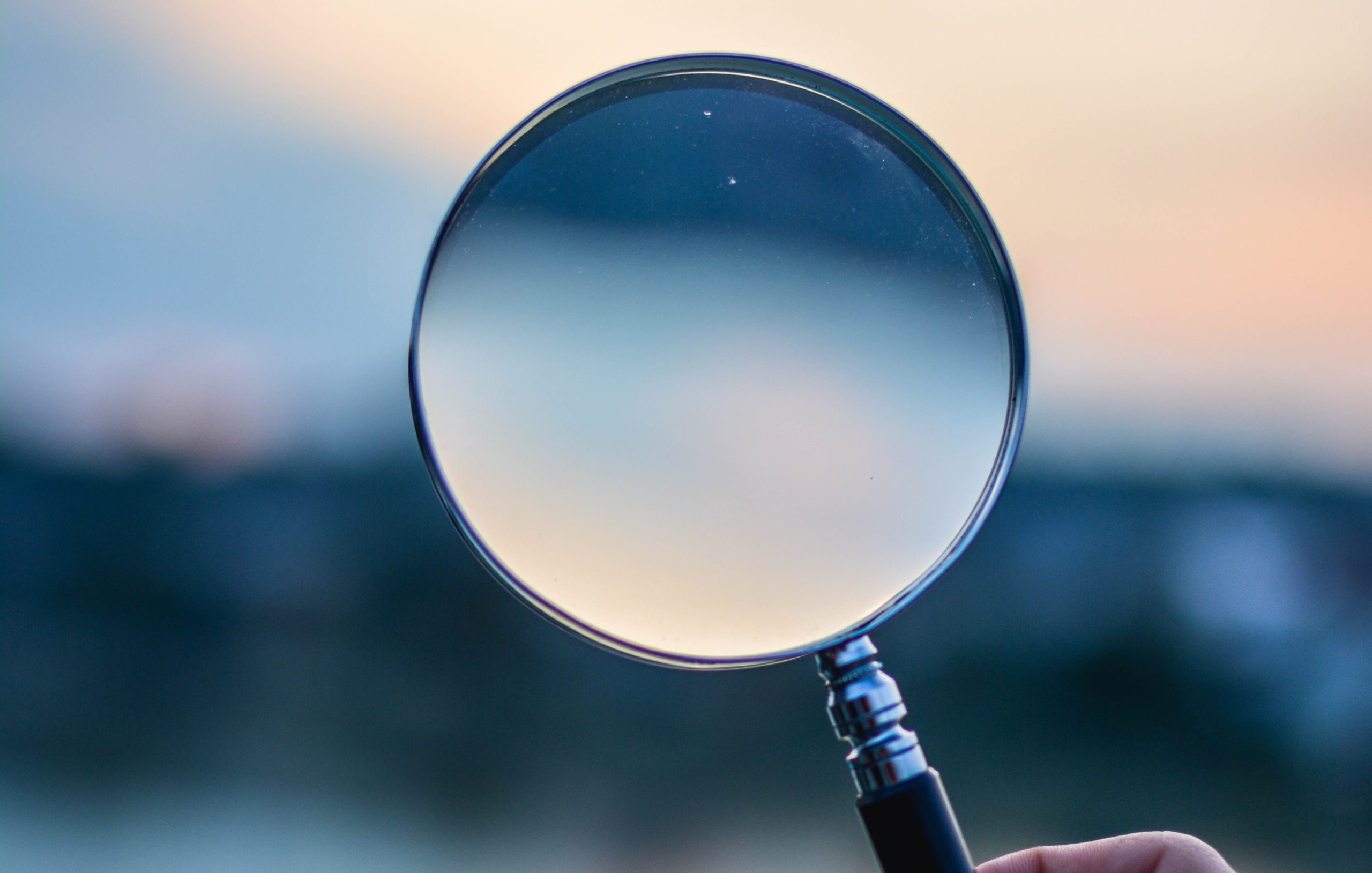 Woman holding a magnifying glass